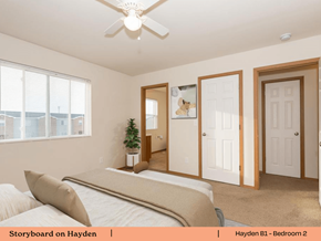Mascoutah apartment for rent - a bedroom with a bed and a ceiling fan