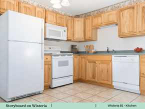 Swansea apartment for rent - a kitchen with white appliances and wooden cabinets