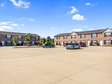 Lebanon apartment for rent - A parking lot with cars and apartment buildings in the background.