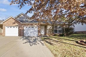 O'fallon apartment for rent - a brick house with a white garage door