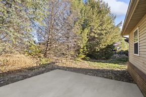 O'fallon apartment for rent - a covered patio with trees in the background on a sunny day