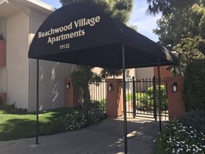 Huntington Beach apartment for rent - the entrance to the beachwood village apartments is guarded by a gate