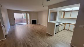 West Hollywood apartment for rent - A kitchen area with a sink, cabinets, and a window.