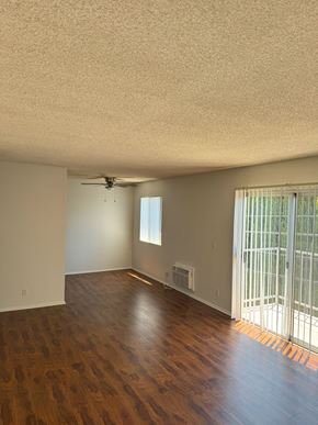 Mar Vista apartment for rent - A room with a ceiling fan and a window with blinds.