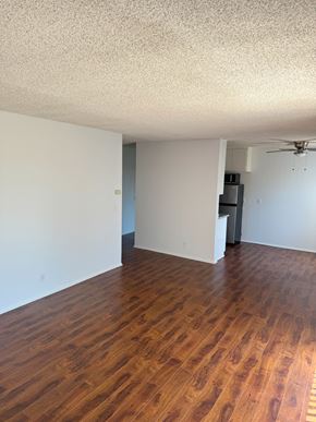 Mar Vista apartment for rent - A room with wooden floors and a ceiling fan.