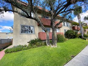 Redondo Beach apartment for rent - A house with a red roof and a tree in front.