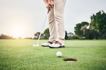 Person is playing golf 