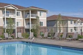 Elkhorn apartment for rent - A swimming pool is in front of apartment buildings.
