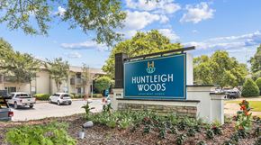 Mobile apartment for rent - A sign for Huntleigh Woods is shown in front of a building.