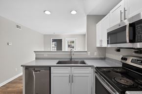 Louisville apartment for rent - A modern kitchen with a stainless steel dishwasher and oven.