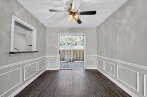 Jackson apartment for rent - A room with a ceiling fan and a window with a view of trees.