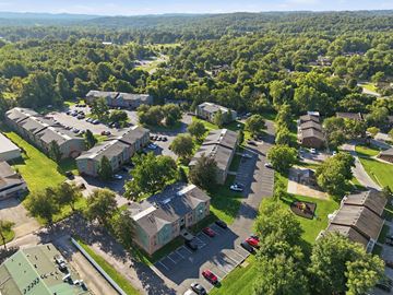 Louisville apartment for rent - A bird's eye view of a residential area with houses and cars.
