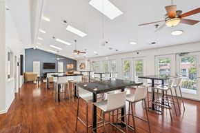 Lexington apartment for rent - A modern dining room with a black table and chairs.