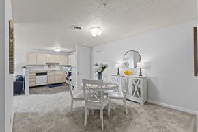 Springfield apartment for rent - a dining area with a table and chairs and a kitchen in the background