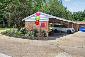 Evansville apartment for rent - A car is parked in front of a building with a red sign that says "NO PARKING".