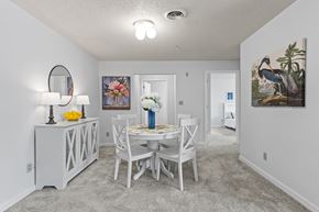 Springfield apartment for rent - a dining room with a table and chairs and a mirror in a house