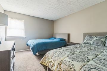 Lexington apartment for rent - A bedroom with two beds and a dresser.