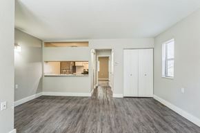 Holland apartment for rent - A room with a grey floor and white walls.