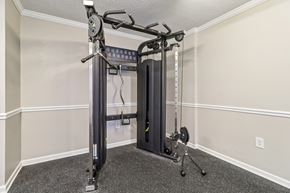 Columbia apartment for rent - Fitness center with squat rack and bench at Avalon Place Columbia SC