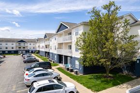 Springfield apartment for rent - a row of apartment buildings with cars parked in front of them