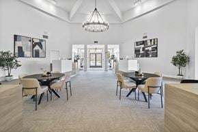 Carrollton apartment for rent - A modern dining room with a large table and chairs.