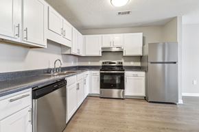 Columbia apartment for rent - Kitchen with white cabinets and stainless appliances at Avalon Place Columbia SC