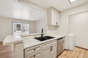 Westland apartment for rent - A kitchen with a white counter top and a window.