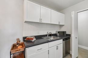 Canton apartment for rent - Kitchen with white cabinets at Bainbridge Park Canton MI