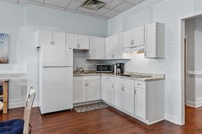 Springfield apartment for rent - a kitchen with white cabinets and a counter top