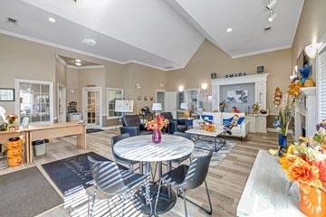 Omaha apartment for rent - A living room with a white table and chairs.