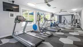 Swartz Creek apartment for rent - Fitness center with cardio equipment at Atlas North Swartz Creek MI
