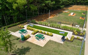 Outdoor amenities with cornhole & dog park - the foundry carrollton - professionally operated by highlands vista group