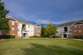 Spacious grounds with green space - the foundry carrollton - professionally operated by highlands vista group
