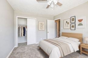 Augusta apartment for rent - A bedroom with a large bed and a wardrobe.