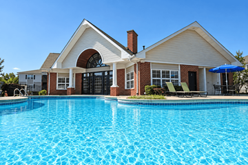 Louisville apartment for rent - A house with a pool in front.