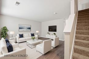 West Des Moines apartment for rent - A living room with a staircase on the right side.