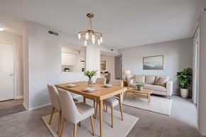 Richmond apartment for rent - A dining room with a wooden table and chairs.