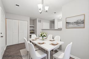 West Des Moines apartment for rent - A dining room with a white table and chairs.