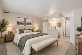 Westland apartment for rent - A bedroom with a large bed and two framed pictures on the wall.