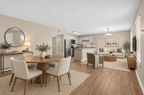 Millbrook apartment for rent - A well-lit, modern dining area with a table set for four and chairs surrounding it.