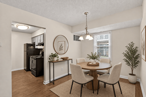 Evansville apartment for rent - A dining room with a table set for four.