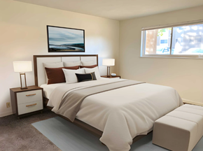 Peoria apartment for rent - A bedroom with a large bed and a painting above it.