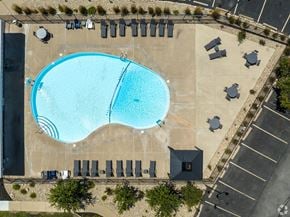 Peoria apartment for rent - An aerial view of a swimming pool surrounded by lounge chairs.