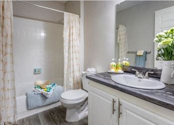Granite style countertops in the kitchen and bathrooms