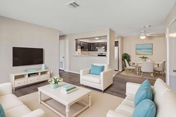 Lake Charles apartment for rent - A living room with a white couch and a coffee table.