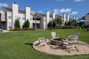 Mobile apartment for rent - our apartments showcase a fire pit in the middle of our grassy area