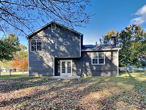 Hampton house for rent - a blue house with a yard and a fence