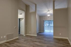 Akron apartment for rent - an empty living room with a door to a patio