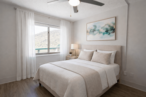 Montgomery apartment for rent - A bedroom with a large bed and a painting on the wall.