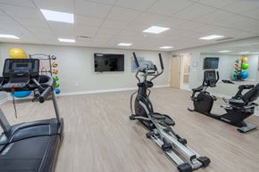 Columbus apartment for rent - A gym with treadmills, elliptical machines, and other exercise equipment.